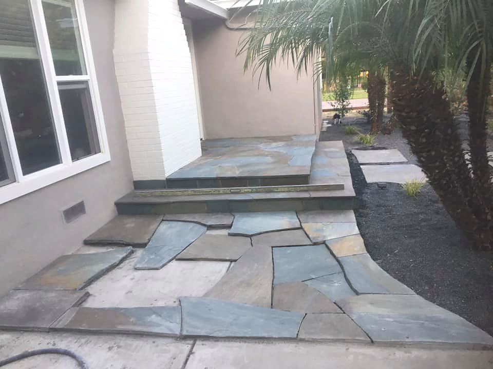 Custom flagstone slate patio with raised steps by Warrens Masonry Central Valley CA