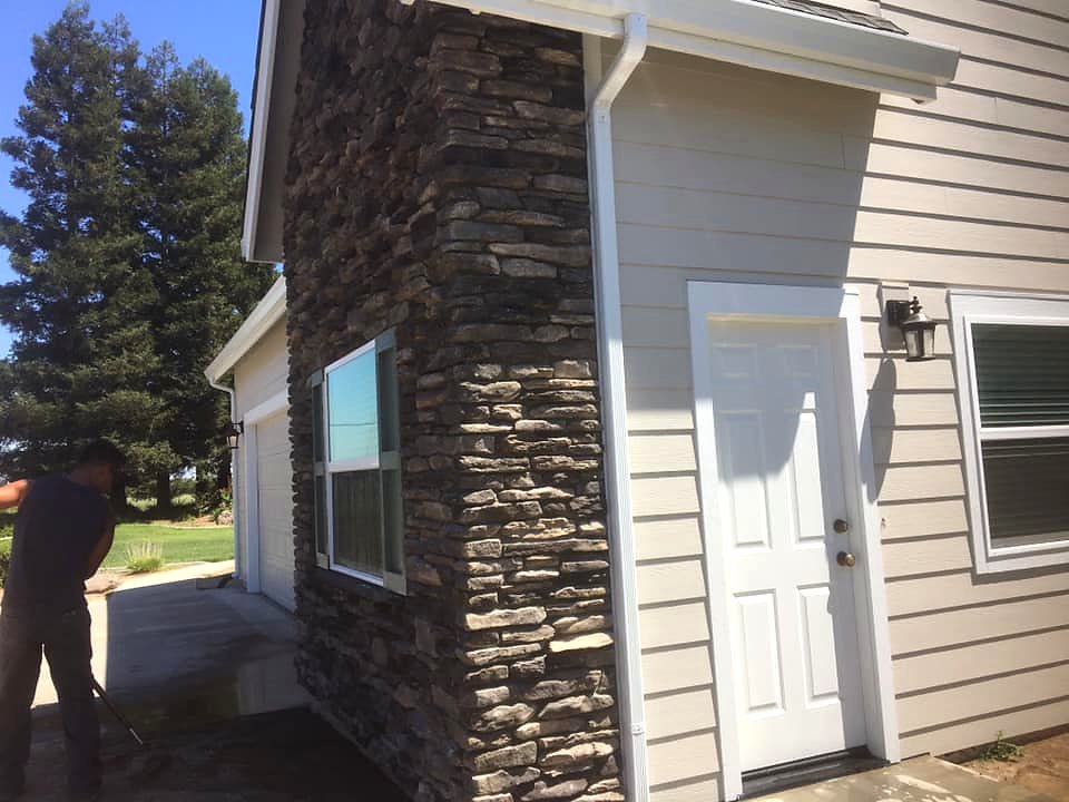 Ledger stone veneer on residential home exterior by Warrens Masonry