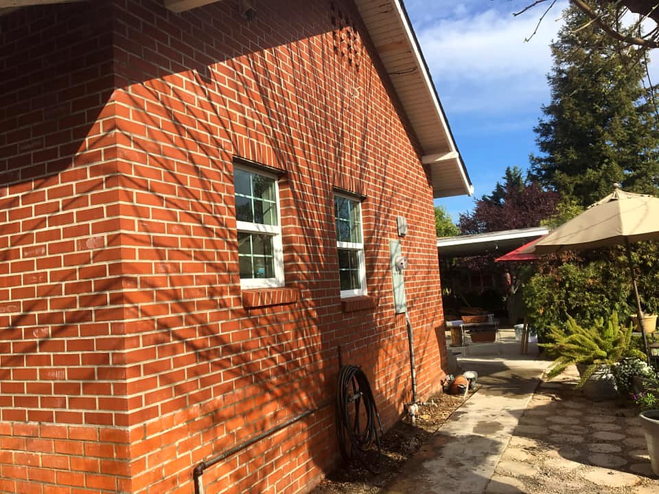 Classic red brick home exterior restoration by Warrens Masonry