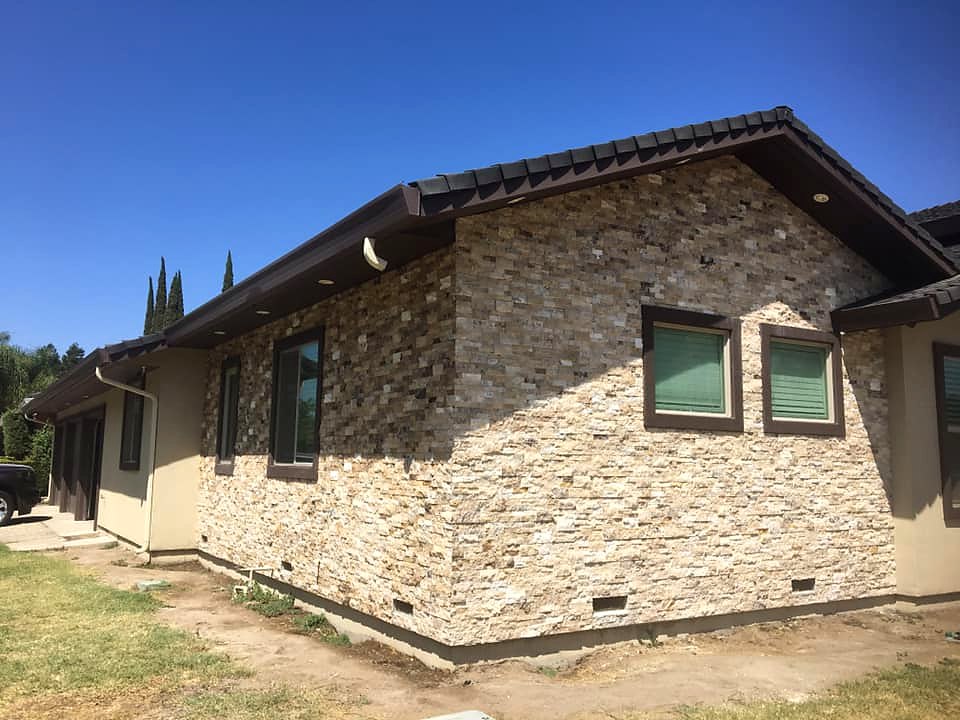Complete stone veneer wrap on home exterior by Warrens Masonry Central Valley CA